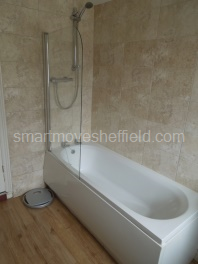 Bathroom with shower over bath