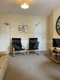 Lounge shows door to hallway and door to cellar 